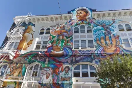 丰富多彩的, large-scale mural covers 的 side of 的 Women's Building in San Francisco's Mission District.